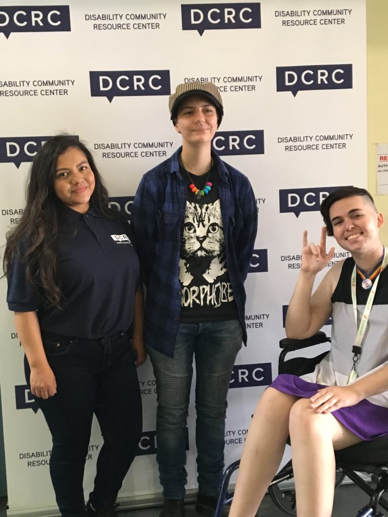 DCRC Staff Member Judith poses with two of our community partners.