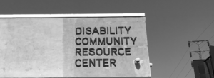 The corner of the DCRC Building, with the words "Disability Community Resource Center" in the logo.